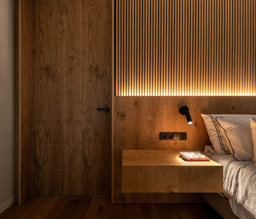 Diseño y arquitectura de cabecero de cama iluminado con madera